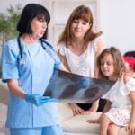 Mom and kid with doctor radiography